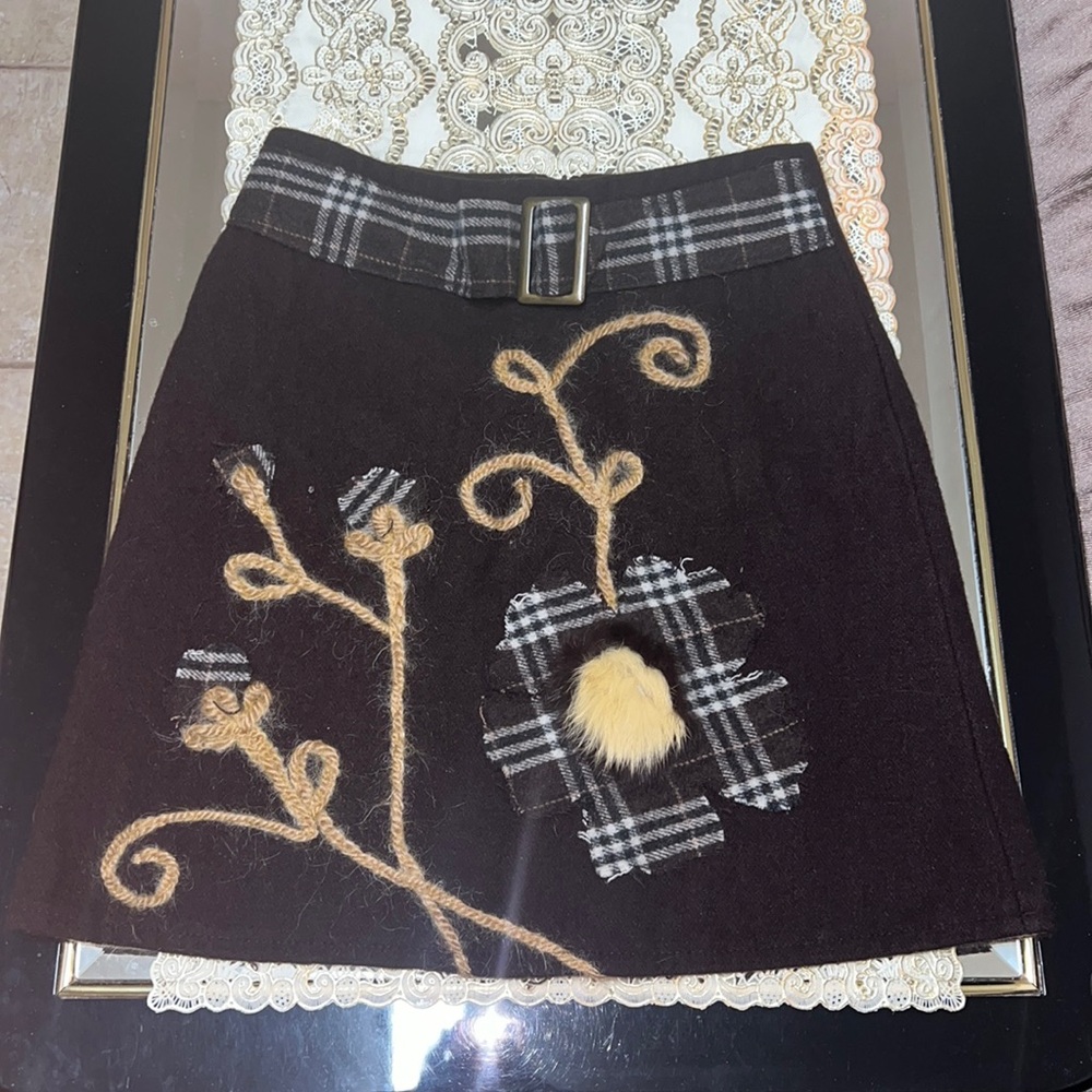 Dark brown felt mini skirt with flower pattern